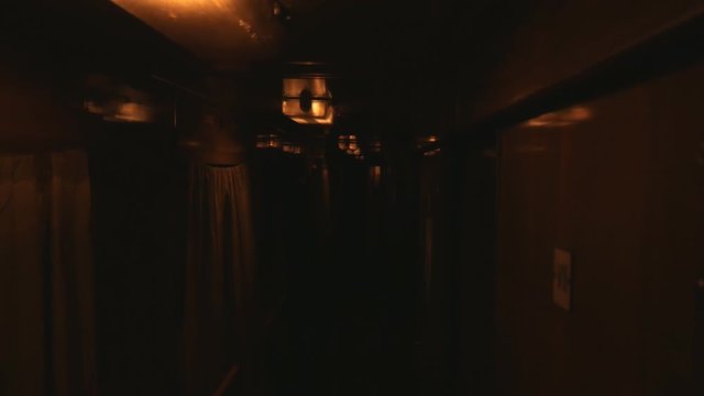 Very dark in a train car. Interior inside lifestyle train, view corridor in the compartment car from night moving train railway Ukrain.