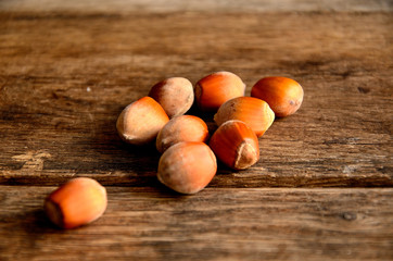 Hazelnuts on a background of old boards.