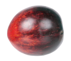 Fresh ripe black tomato isolated on white background