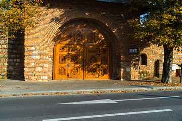Wooden door at the entrance of Stelea Monastery – Nifon House Museum in Targoviste, Romania –...