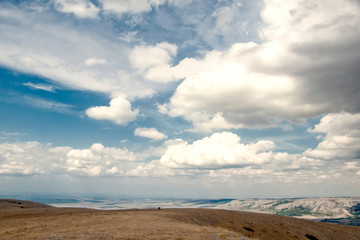 Mountains in the Crimea. Beautiful blue sky and large white clouds. Autumn.