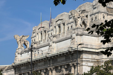 statues on the milan city railway station in italy 