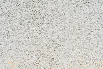 Gray stucco on wall of house. Construction industry.