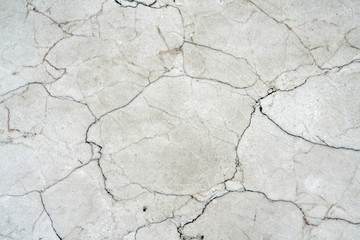 Fototapeta premium Cracks of gray marble. Wall of house. Construction industry.