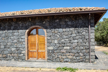 old wooden door in stone wall