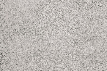 Gray stucco on wall of house. Construction industry.