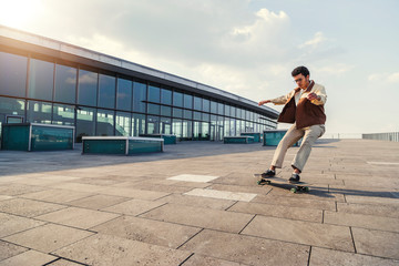 African american guy makes side turn on skateboard