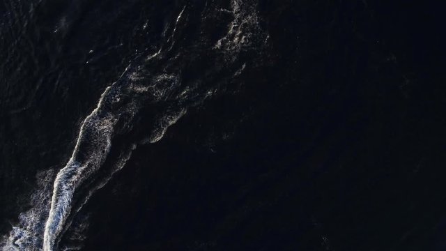 Aerial view of rider on jet ski on the lake in the summer