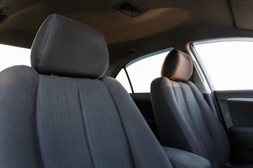 Car interior, part of front seats, close