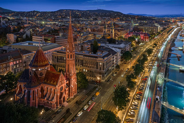 Fototapeta na wymiar Budapest, Hungary - Aerial view of the beautiful Szilagyi Dezso Square Reformed Church at the Buda side of Budapest. Taken at blue hour after sunset