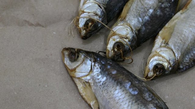 Dried Salt Fish Kraft Paper Background Panning Slider Shot.
