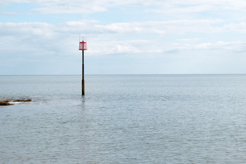 Post in the sea in Devon, England