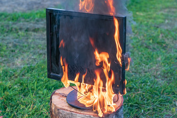 computer, monitor on fire. there is a keyboard. concept time to update junk.