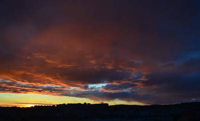 Silhouette City Sunset with clouds in Murmansk Russia with dramatic red, blue and ornage sky