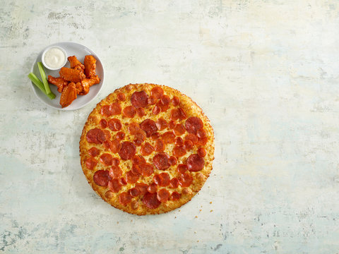 pepperoni pizza with buffalo wings