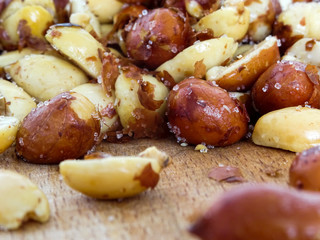 Peanut on the wooden and blurry background salty close up