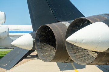 The tail and nozzles of a fighter jet engine.
