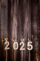 New year calendar 2025 concept on old brown wood