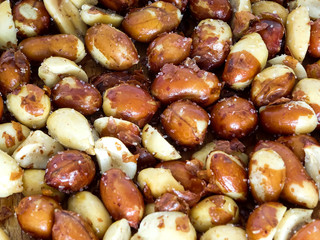 Peanut on the wooden and blurry background salty close up