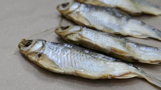 Dried Salt Fish Kraft Paper Background Panning Slider Shot.
