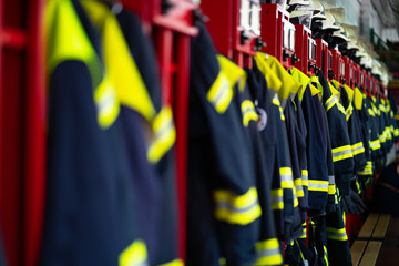 Firefighter suits and helmets at fire station - 289160622