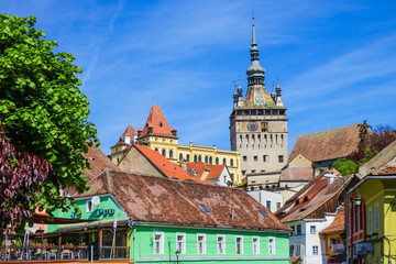 Fototapeta premium Sighisoara, Romania, May 15, 2019: Old and colorful houses in Sighisoara citadel. Medieval architecture.