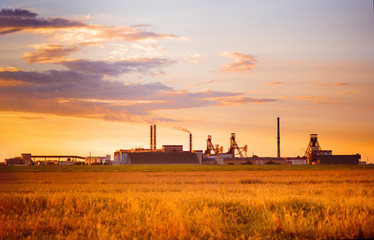 Fototapeta na wymiar Sunset over the potash plant.Industrial landscape at sunset.