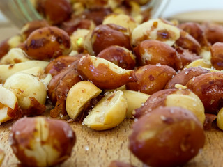 Peanut on the wooden and blurry background salty close up