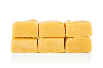 Group of six whole sweet golden caramel candy isolated on white background