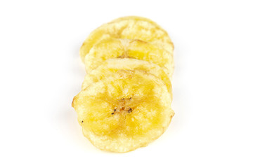 Group of five slices of sweet yellow dry banana isolated on white background