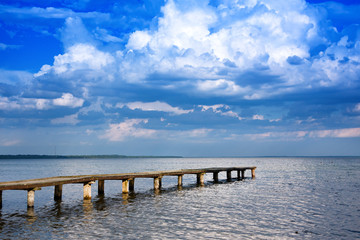 Panoramic sky over Naroch lake and pier. Belorussia