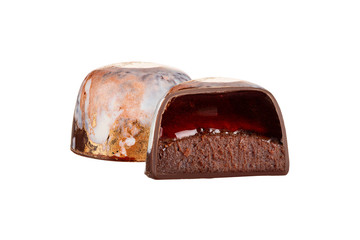 Cut luxury handmade bonbon with chocolate ganache and liquid filling isolated on white background