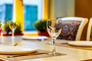 Laid table in the restaurant waiting for guests.
