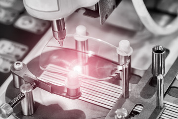 Lens manufacturing in modern laboratory.
