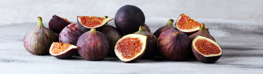 Fresh figs. Food Photo. whole and sliced figs on beautiful rustic background.