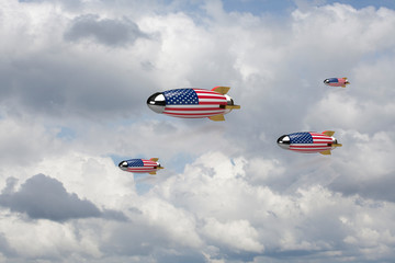 Naklejka na ściany i meble Rockets with flag of the USA in the sky.