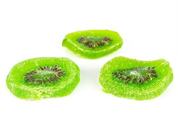 Group of three slices of sweet green candied kiwifruit isolated on white background