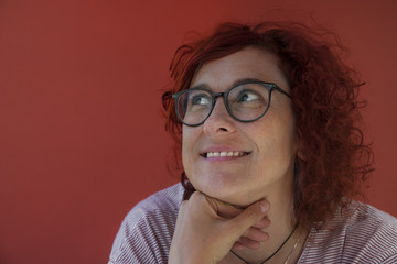 pensive happy redhead girl