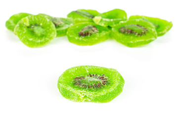 Naklejka na ściany i meble Lot of slices of sweet green candied kiwifruit isolated on white background