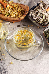 tea with Chamomile, sage and stinging nettle tea. Dried chamomile tea on table