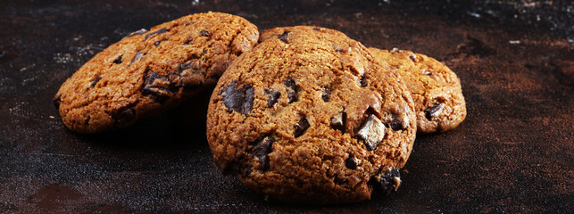 Chocolate cookies on wooden table. Chocolate chip cookies shot on table