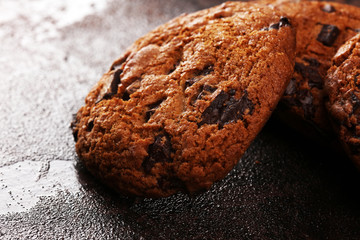 Chocolate cookies on wooden table. Chocolate chip cookies shot on table