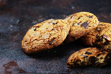 Chocolate cookies on wooden table. Chocolate chip cookies shot on table