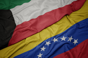 waving colorful flag of venezuela and national flag of kuwait.