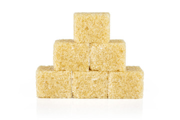 Group of six whole sweet brown sugar cube isolated on white background