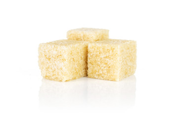 Group of three whole sweet brown sugar cube isolated on white background