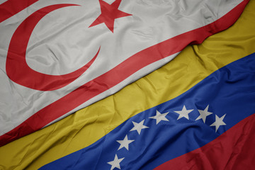 waving colorful flag of venezuela and national flag of northern cyprus.