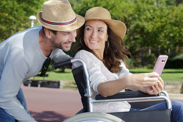 Fototapeta premium couple in wheelchair in park