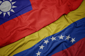 waving colorful flag of venezuela and national flag of taiwan.
