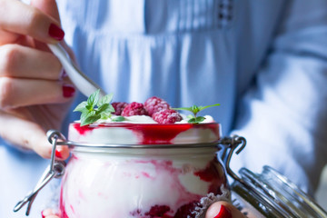 Delicious breakfast in woman hands, close up. Healthy eating concept.